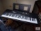 New Yamaha EZ-220 electric keyboard with stand