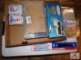 Flat of model making tools and supplies which include masking take, putty, cutting tools etc
