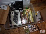 Clear tote of model paint, brushes, storage units, etc