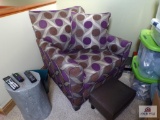 Chair with purple, brown and silver pattern along with foot stool