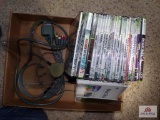 Flat of various Xbox video games and cable