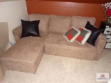 Small couch with under cusion storage and pullout drawer to convert to bed