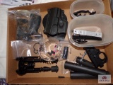 Flat of misc gun parts to include bipod, holster, grips etc