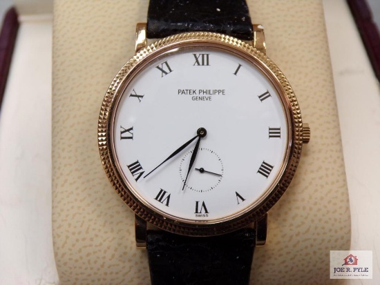 Patek Philippe Geneve watch in case with outer carton, certificate of origin, case shows extensive