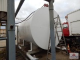 Large white 10,000-gallon tank on skids