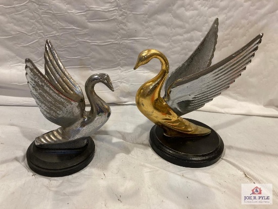 2 Packard swan hood ornaments