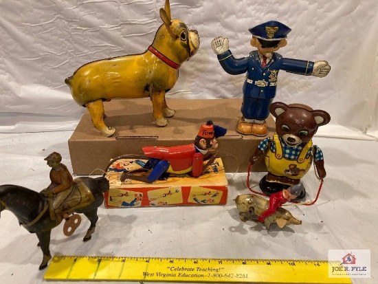 6 tin wind-ups: Dog US Zone Germany, policeman, bear, monkey, man on horse, and man on pig