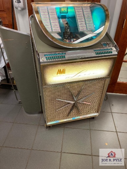 AMI Model XJGA-100 juke box, 50" x 28" x 27", lights up, as found