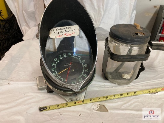 1969 Corvette speedometer head and 1959 Cadillac glass washer bottle