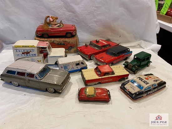 10 tin friction cars: Ice Cream, Fire Chief, Police, Opel Rekard 4" to 9"