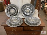 Set of 4 Cadillac hubcaps and 2 Packard hub caps