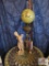 Lamp with decorative statute with pedestal candle holder