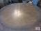 Round pedestal table with glass top 58 inch diameter.