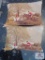 2 Needlepoint hunting scene pillows and stack of vintage books