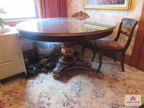Round ornate inlaid pedestal glass topped table, diameter of 58 inches, MUST BRING HELP TO LOAD