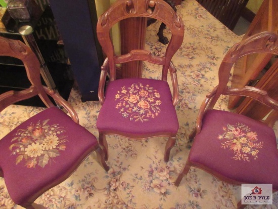 Three vintage carved chairs with needlepoint seats