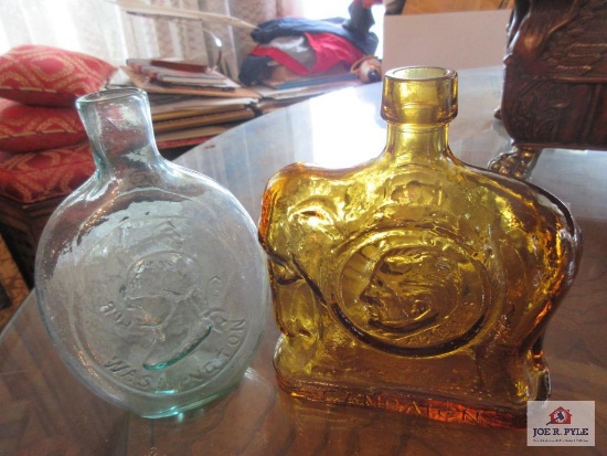 Two glass bottles with images of G. Washington and S. Agnew
