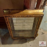 Gold framed wall display case