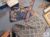 Two rugs and a roll of fabric (length unknown)