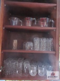Glassware in kitchen cabinet