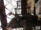 Birdcage with floral arrangement
