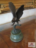 Eagle statue on green marble pedestal