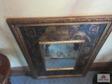 Mirror in decorative frame