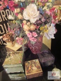 flower arrangement with decorative phone and d?cor boxes