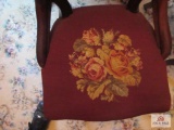 Two vintage carved chairs with needlepoint seats