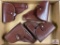 [737] Four leather flap holsters (brown)