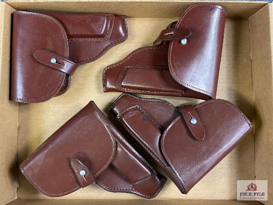 [737] Four leather flap holsters (brown)