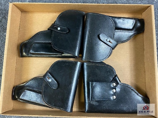 [738] Four leather flap holsters (black)