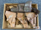 [687] Four leather flap holsters + partial shoulder holster harness