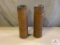 [555] Two large brass shell casings