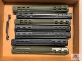 [505] Seven handguards and a base