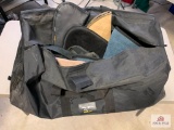 [179] Three pistol cases, three gun socks, and a holster in a black duffel