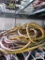 Assortment of extension cords on wire shelf