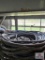 Assortment of extension cords and wire on metal shelf