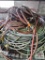 Assortment of hoses on wire shelf