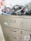 tan metal cabinet and contents
