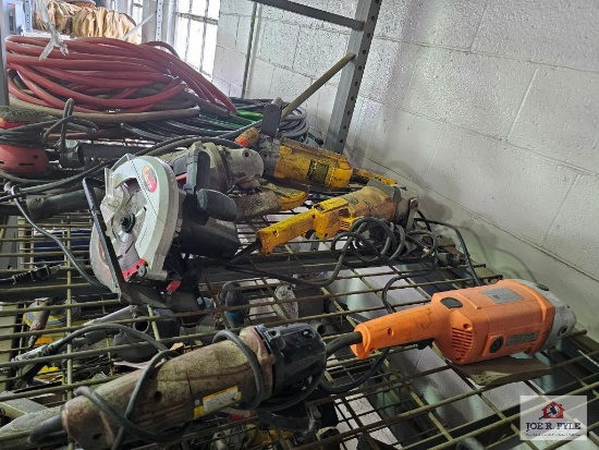 Misc. electric power tools on wire shelf