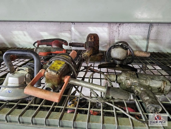 Misc. electric power tools on wire shelf