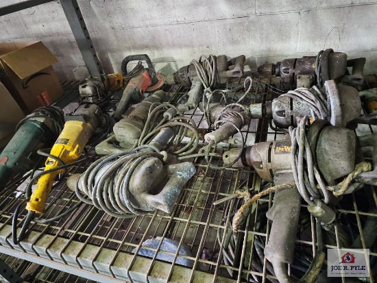 Misc. electric power tools on wire shelf