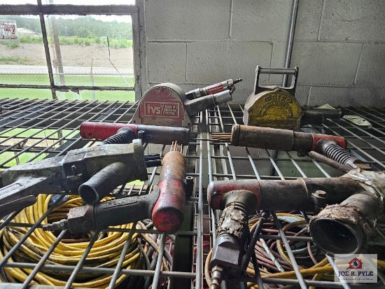 Misc. air power tools on wire shelf