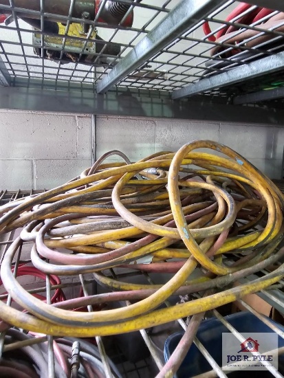 Assortment of extension cords on wire shelf