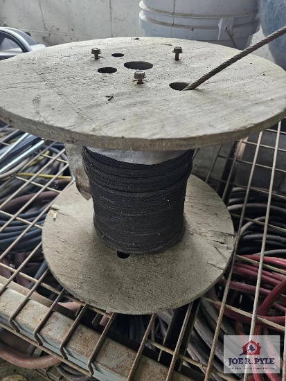 Spool of cable in wire shelf