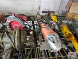 Misc. electric power tools on wire shelf