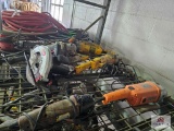 Misc. electric power tools on wire shelf