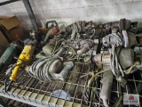 Misc. electric power tools on wire shelf