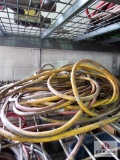 Assortment of extension cords on wire shelf